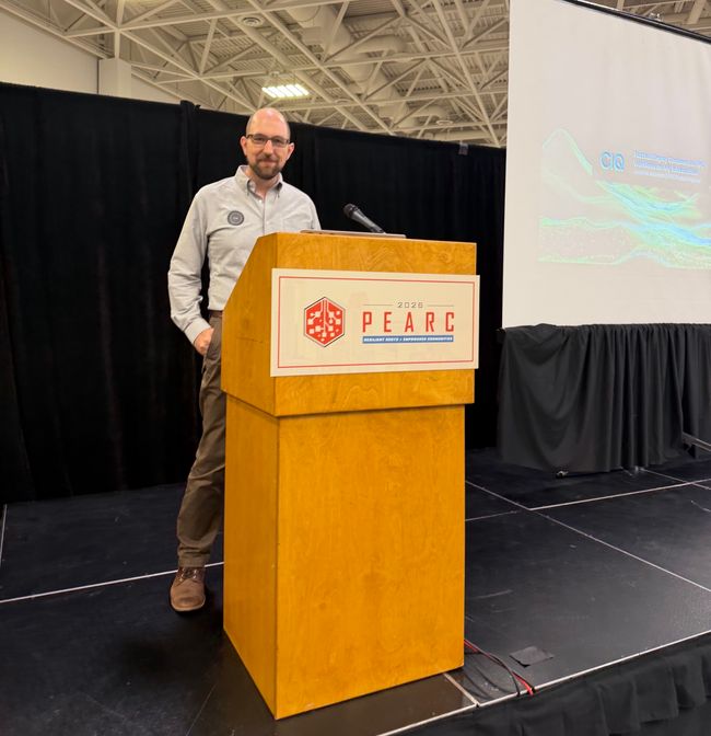 Jonathon Anderson at the podium for his Fuzzball session at PEARC26
